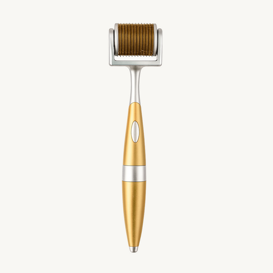 Gold and silver derma roller with micro-needle head on a clean white background