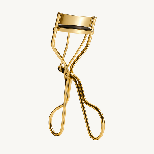 Gold metal eyelash curler for lifting and curling lashes – beauty tool on white background – Verve & Valor