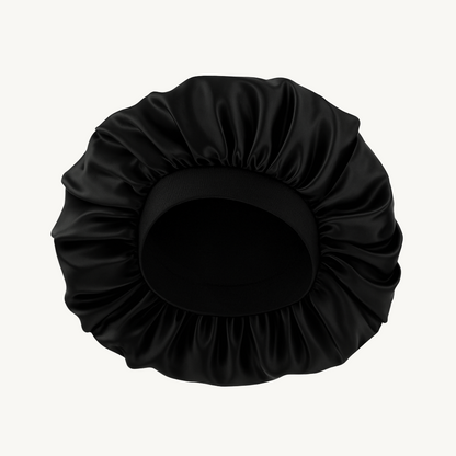 Black satin hair bun cover on a white background